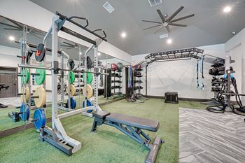 A well-equipped home gym with a variety of exercise equipment.